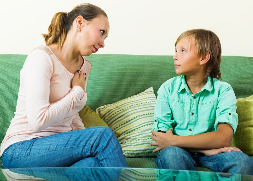Mother with  teenager son having serious conversation